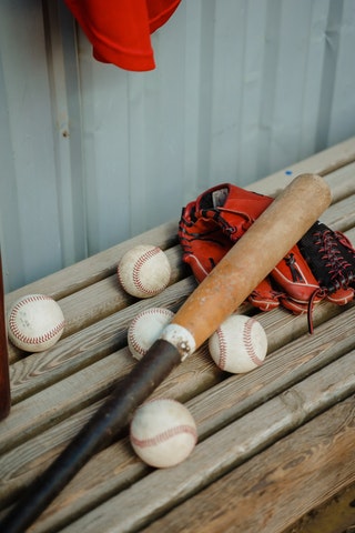 Baseball bat, glove and balls (Photo by Tima Miroshnichenko - Pexels)