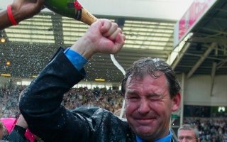 Bryan Robson doused in Champagne