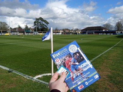 View of the programme and pitch for Chippenham Town vs Welling United